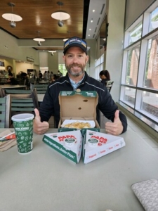 Coach Peter loves pizza!